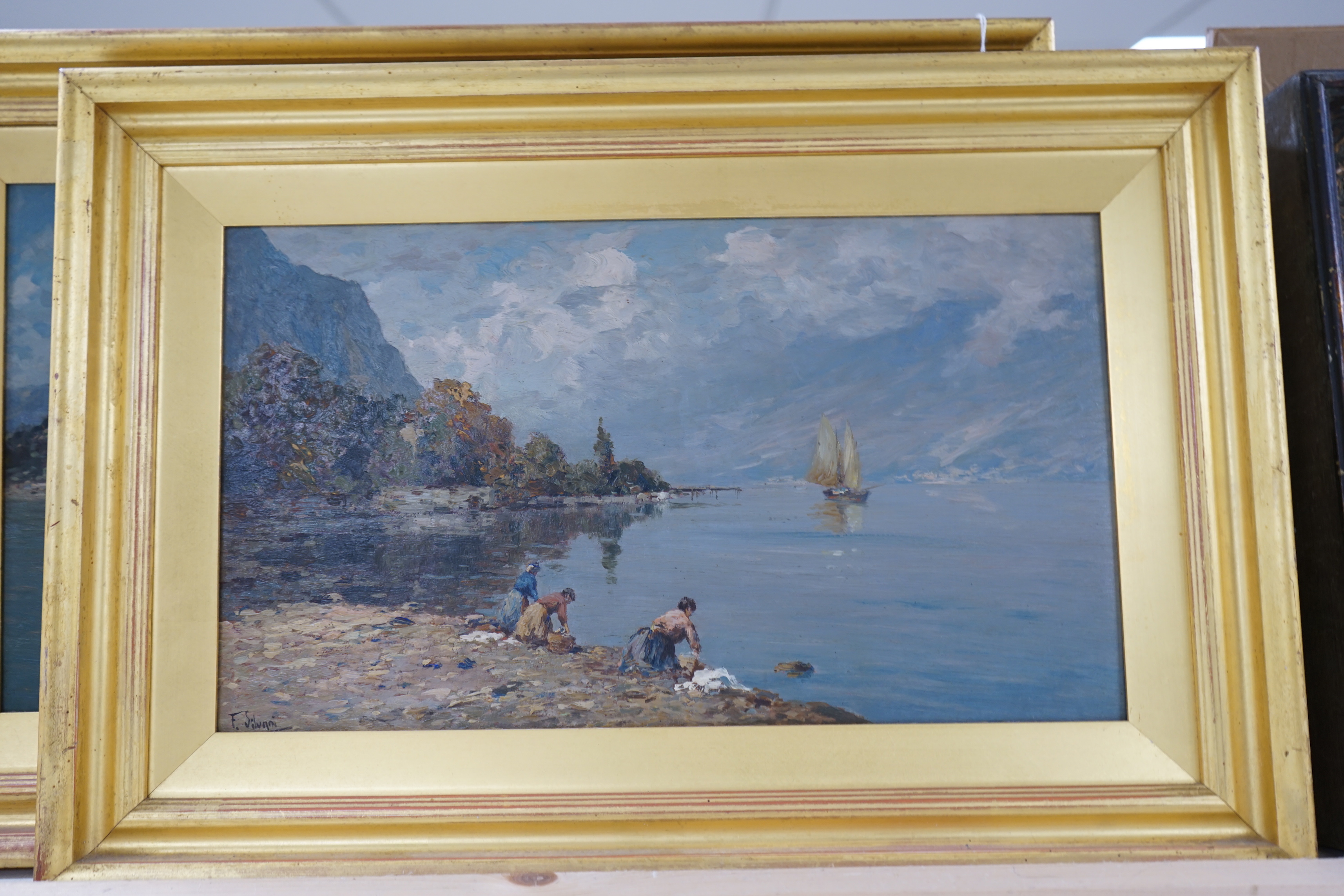 F. Silugni, pair of oils on board, Continental lakeside landscapes, both signed, largest 25 x 43cm